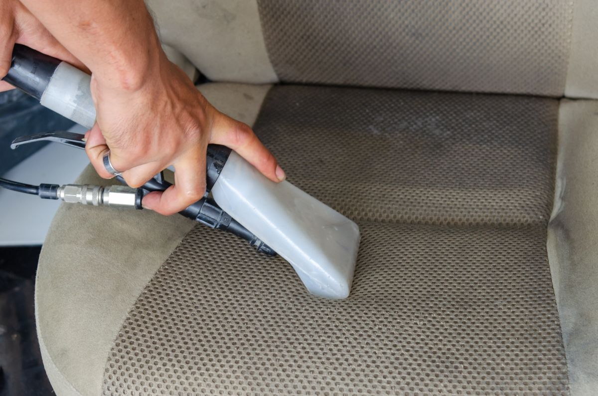 Interior seat deep-cleaning with a steam cleaner, for illustration